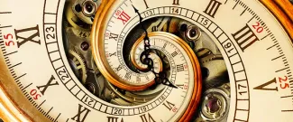 Antique clock spiraling inward, symbolizing time distortion.